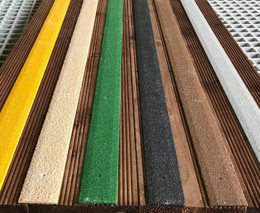 GRP anti-slip decking strips fixed to wet wooden garden decking