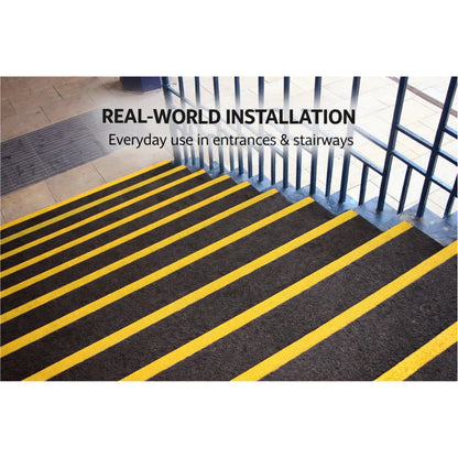 GRP stair tread cover installation on industrial staircase